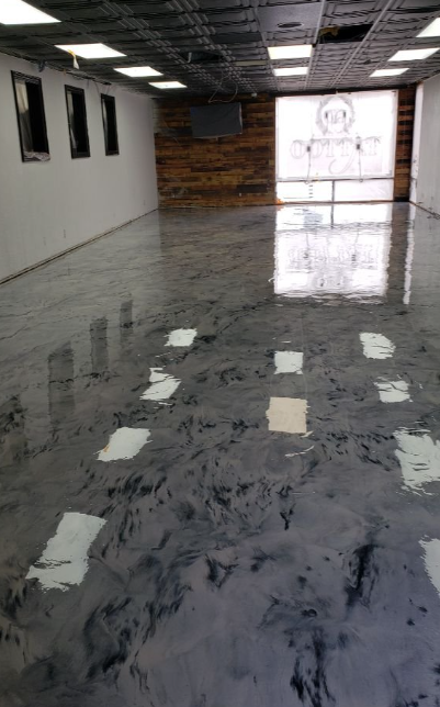 High-gloss metallic epoxy floor in a commercial space